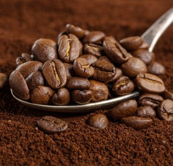 coffee-beans-spoon-ground-coffee-closeup-scaled.jpg